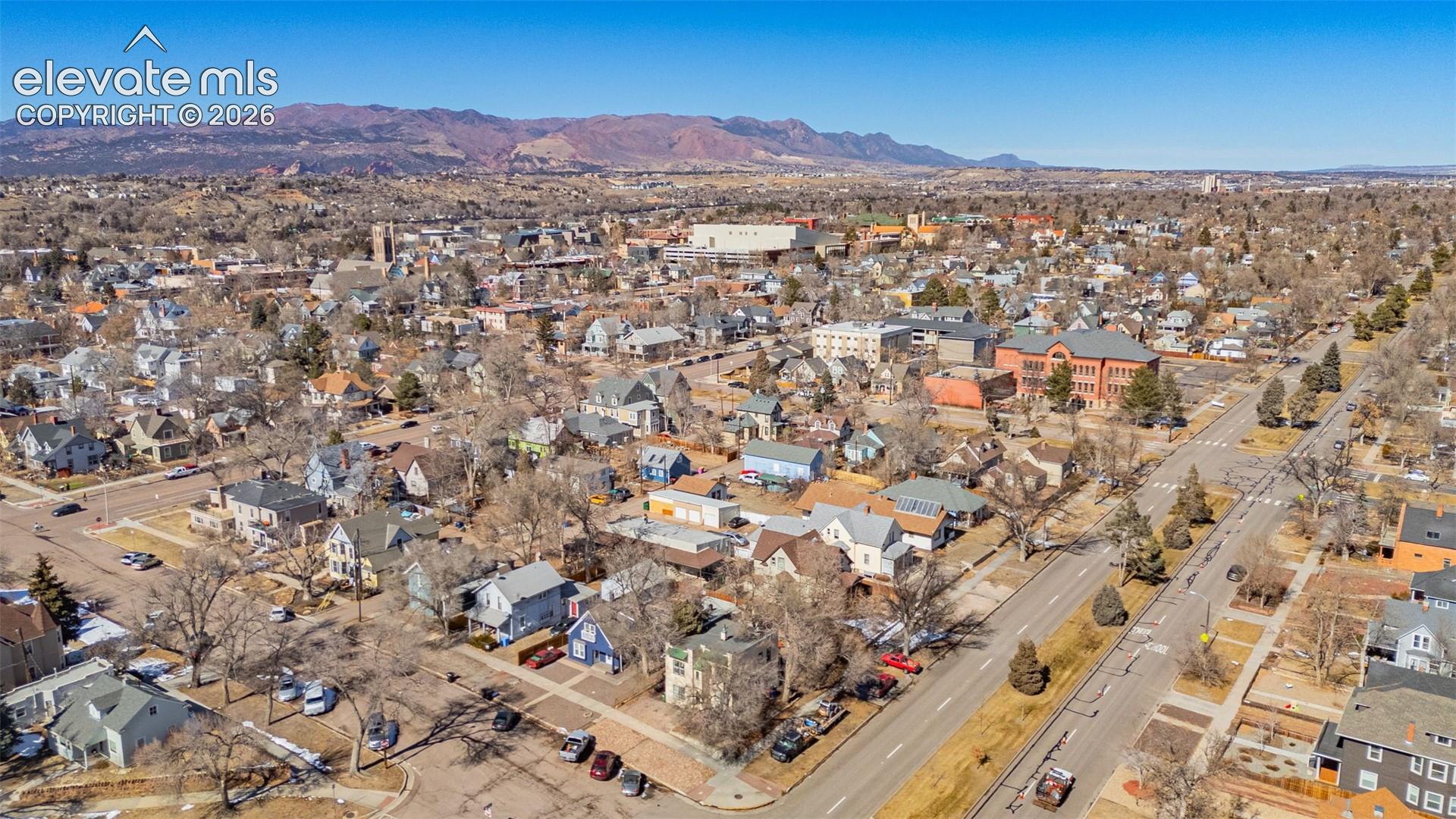 Drone / aerial view featuring a residential view and a mountain view