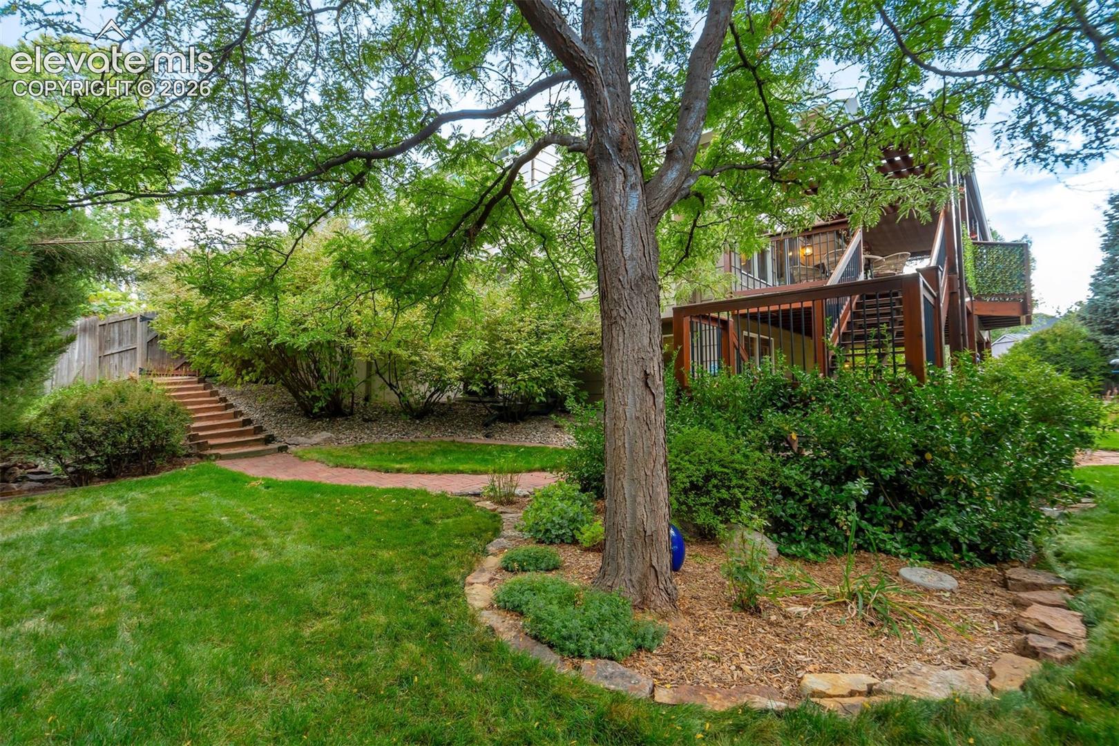 Park-like setting of the grounds, featured on the 2018 City Garden Tour.