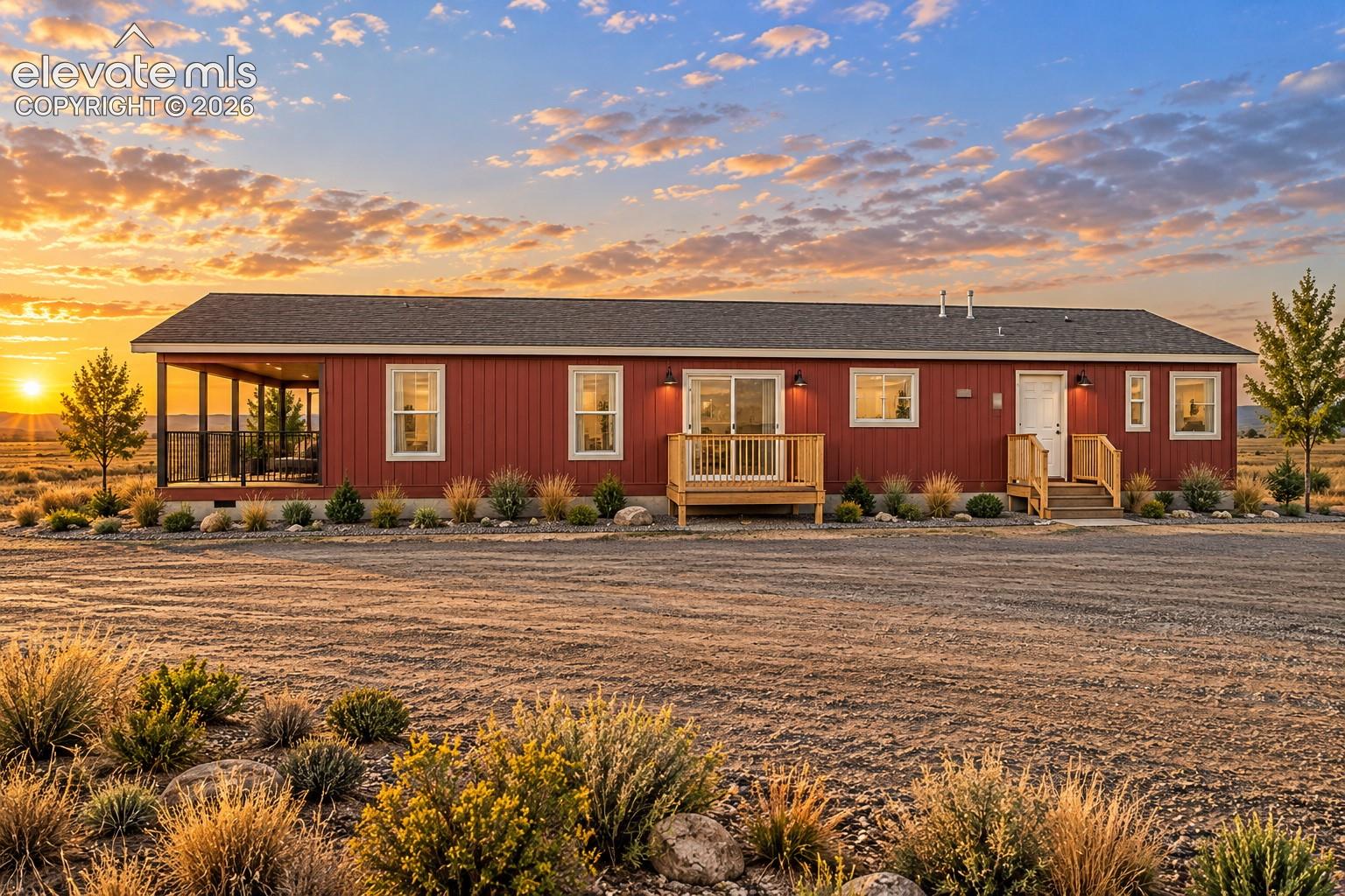 Exterior & Detached Garage – Wide property view captures the home, detached garage, gravel drive