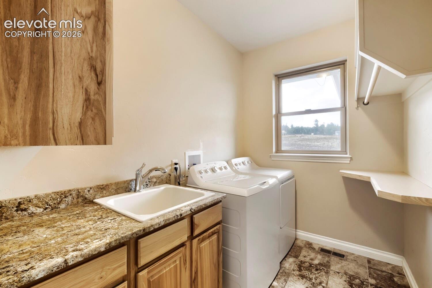 Washer and Dryer are included in the purchase.Observe the laundry room sink and large counter with plenty of natural light.  