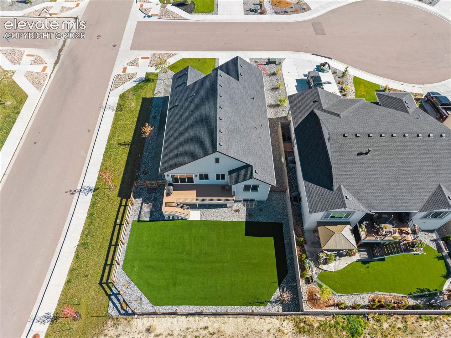 Aerial view of back of the property. Not a leaf out of place. This home is so easy to love and care for! 
