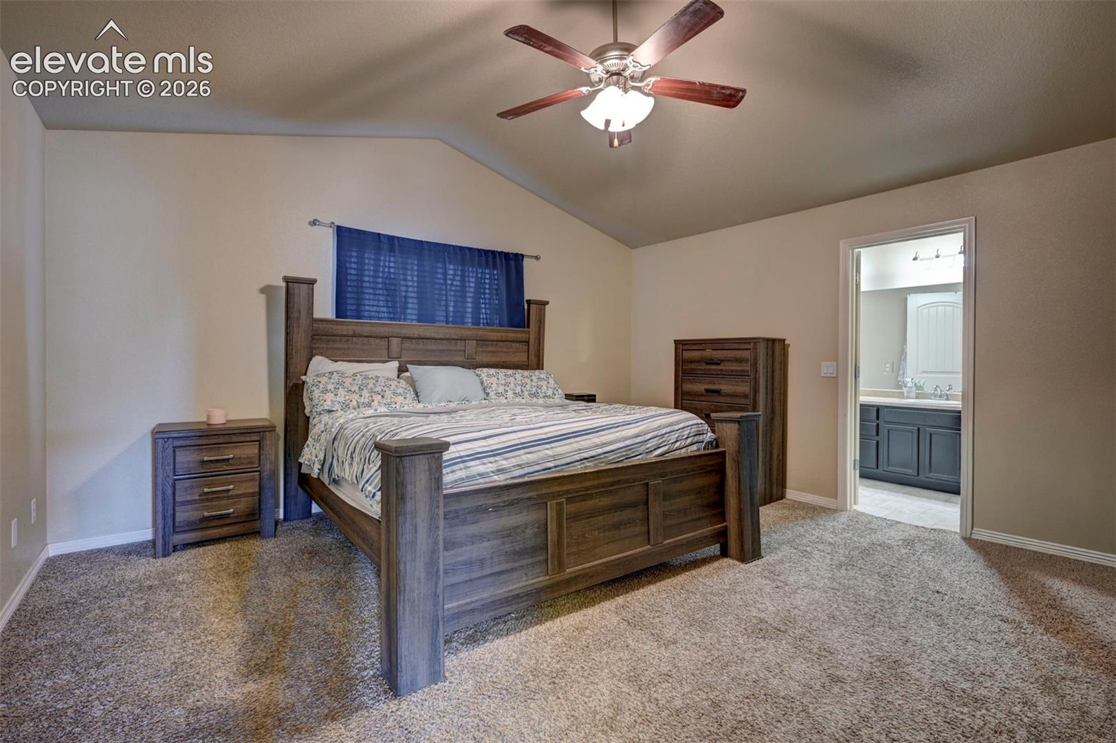 Vaulted ceiling with a ceiling fan