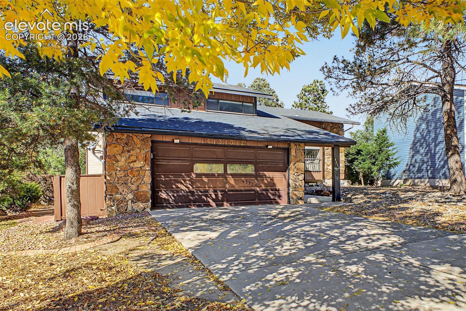 Welcome to this spacious, beautifully updated home offering six bedrooms, thoughtful upgrades, and rare trail-side charm! Step inside to an airy, light-filled main level enhanced by soaring vaulted ceilings and an open flow designed for everyday living and entertaining. The heart of the home features a welcoming kitchen where you can line your favorite plants along the expansive window sill and take in peaceful views of the adjacent Homestead Trail, where you can watch horses pass along the path while doing dishes. ust off the kitchen sits a dedicated dining area perfectly positioned for hosting. This property offers two distinct living spaces to fit every mood—a bright, sun-drenched living room perfect for morning coffee on the main level. While downstairs hosts a cozy, den-like family room centered around the warmth of a classic fireplace & stone detailing. This level also has additional bedroom & powder room for convenience and comfort. From here, step outside to enjoy the generous backyard with ample room for outdoor dining, pets, gardening, and summer gatherings. Upstairs, the expansive primary suite serves as a true private retreat, complete with its own cozy fireplace and a luxurious en-suite bathroom featuring radiant heated floors for chilly Colorado mornings. Also upstairs are two secondary bedrooms & a full bathroom to share. The newly finished, fully permitted basement significantly expands your living space, adding two bedrooms and a stylish 3/4 bath. Whether you need dedicated guest suites, quiet home offices, or space for hobbies, this versatile layout effortlessly adapts to your needs. Ideally located, you are just minutes from Palmer Park for hiking, biking, and outdoor recreation, with easy access to the Powers corridor and First & Main Town Center for premier dining, shopping, and entertainment. Combining modern comfort, cozy character, and a scenic community backdrop, this move-in-ready home is ready to welcome you!