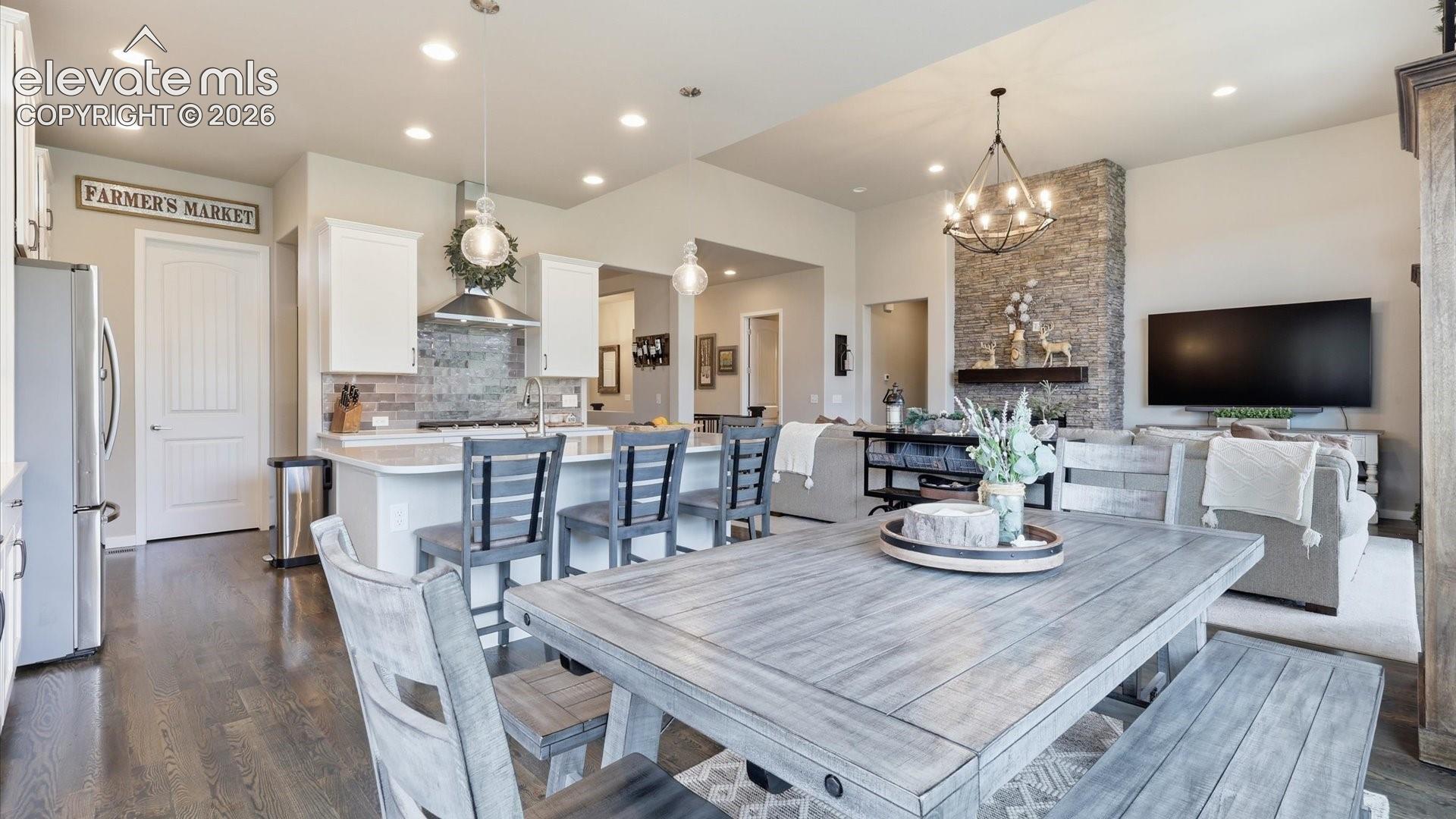 DESIGNED FOR GATHERING — A stunning open-concept kitchen anchored by an oversized island, creating the perfect gathering place for entertaining in style.