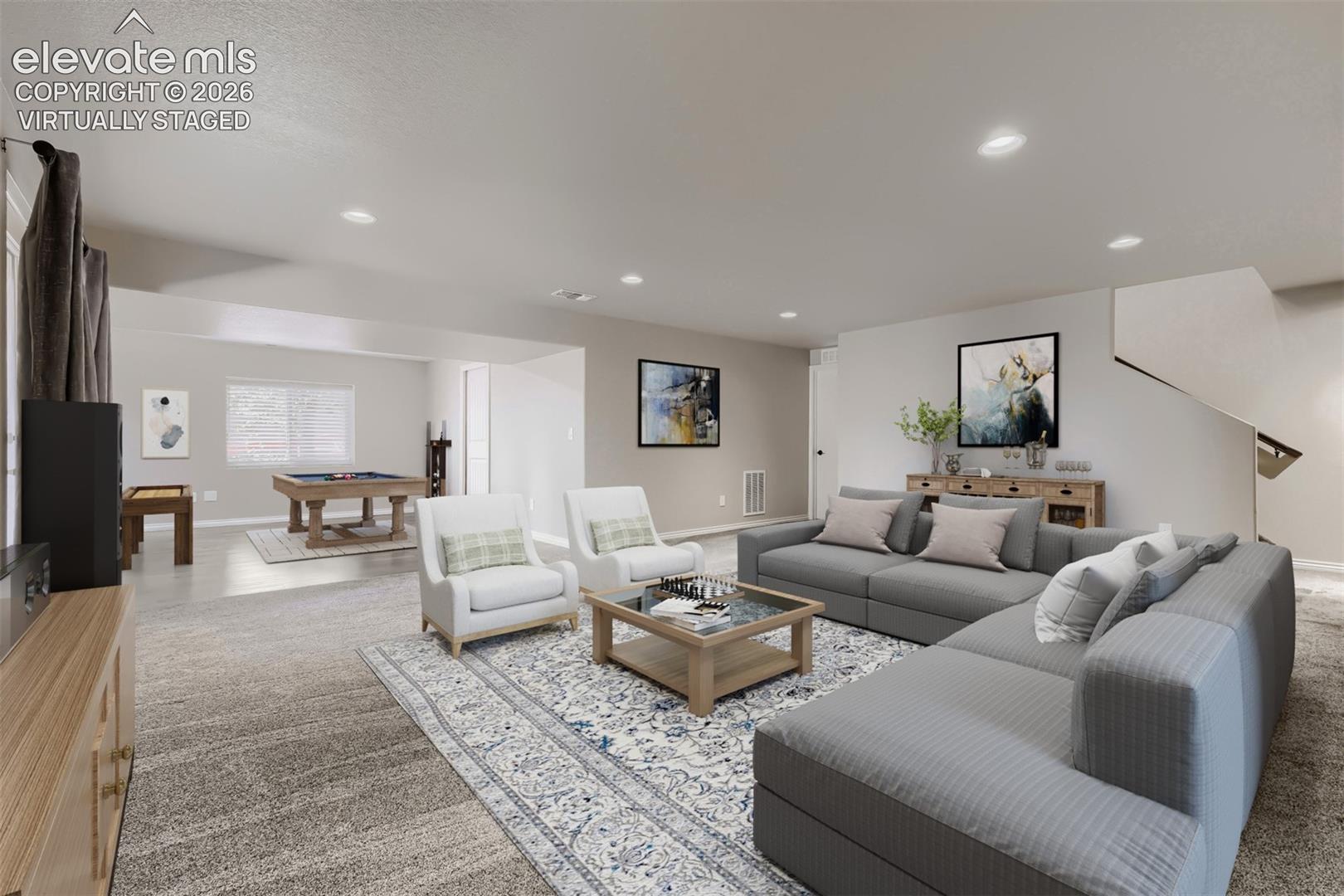 Virtually staged basement family room with walkout, large rec room that can be game area, hobby area, playroom, or exercise room.