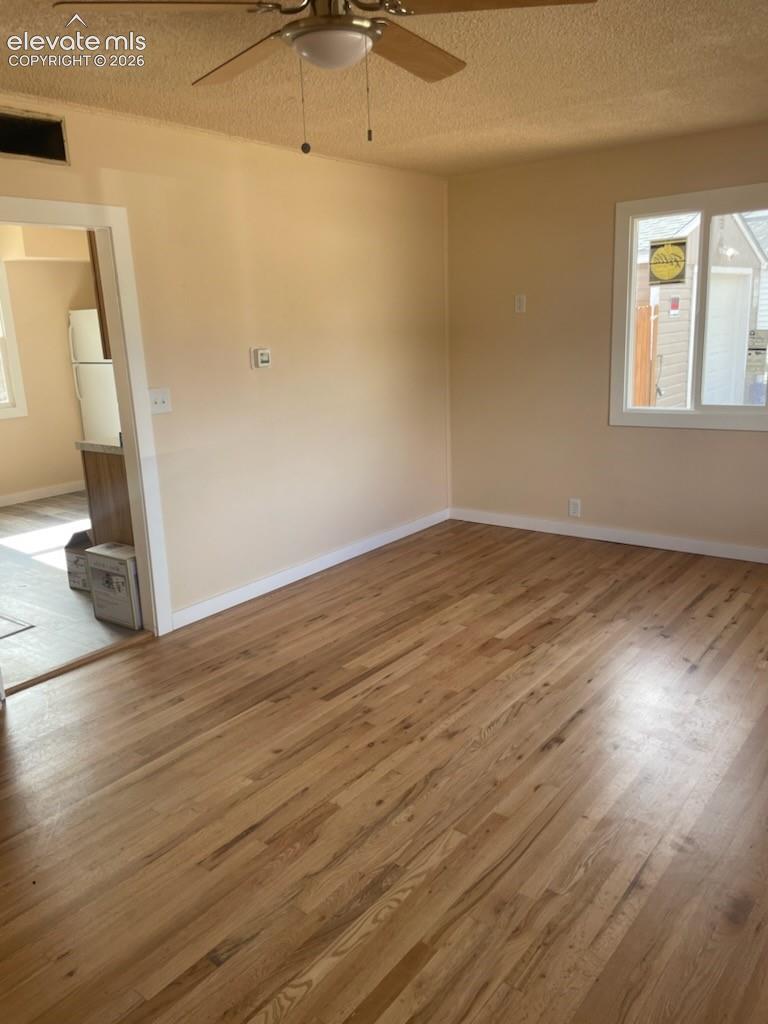 Hardwood flooring, integrated lighting, and dual-pane windows.
