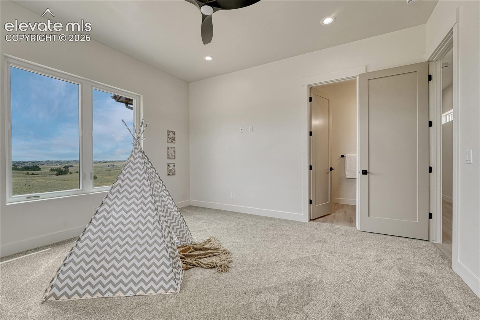 First of two additional main level bedrooms...