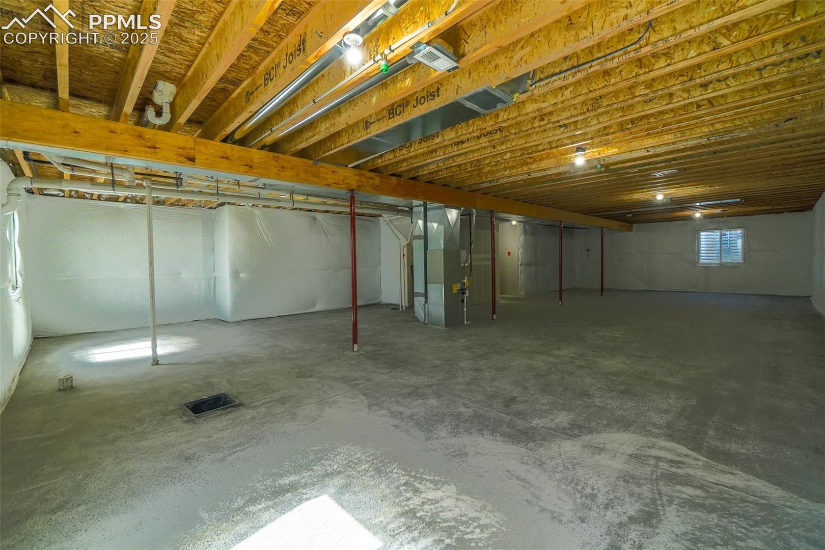 Basement featuring heating unit