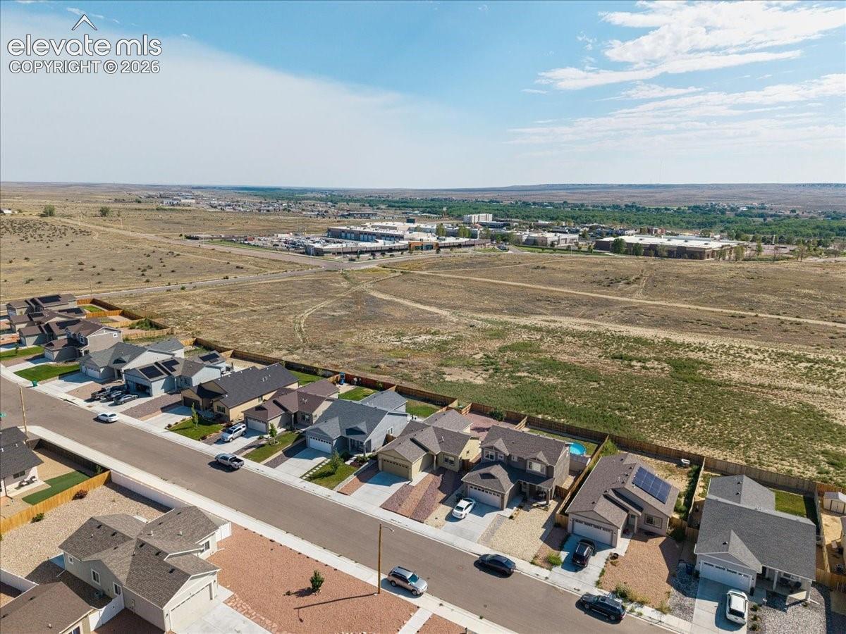 Aerial perspective showcasing residential properties with a mix of single-story and multi-story homes