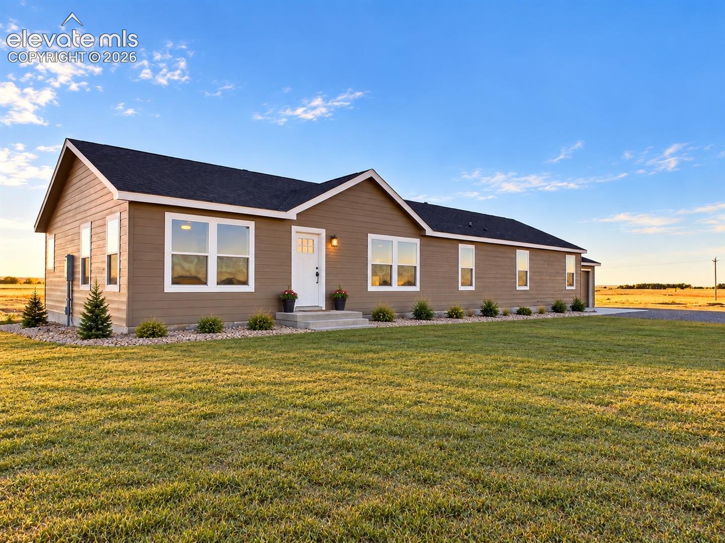 Exterior – Welcoming exterior view showcases rendering of the home’s clean horizontal siding, contrasting trim