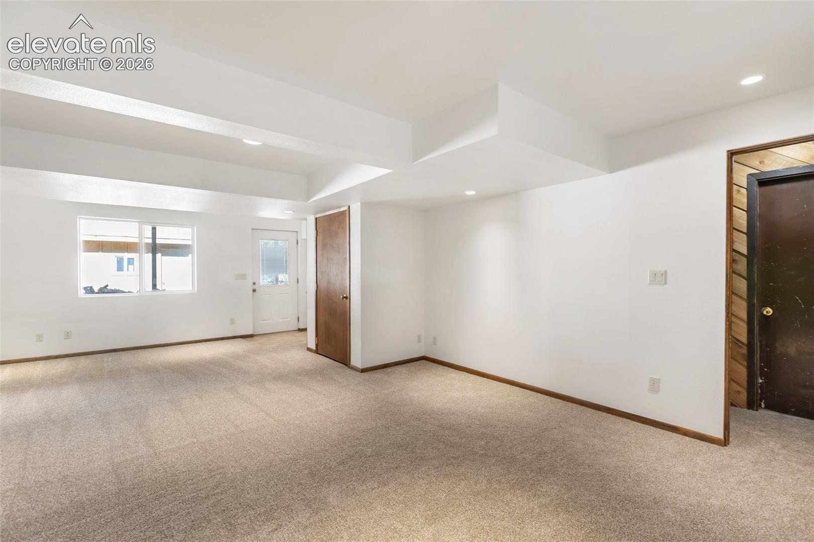 Walk out family room in basement. New carpet.