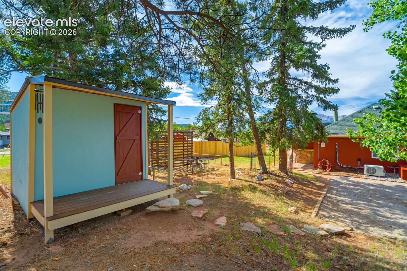 storage shed with darling front porch