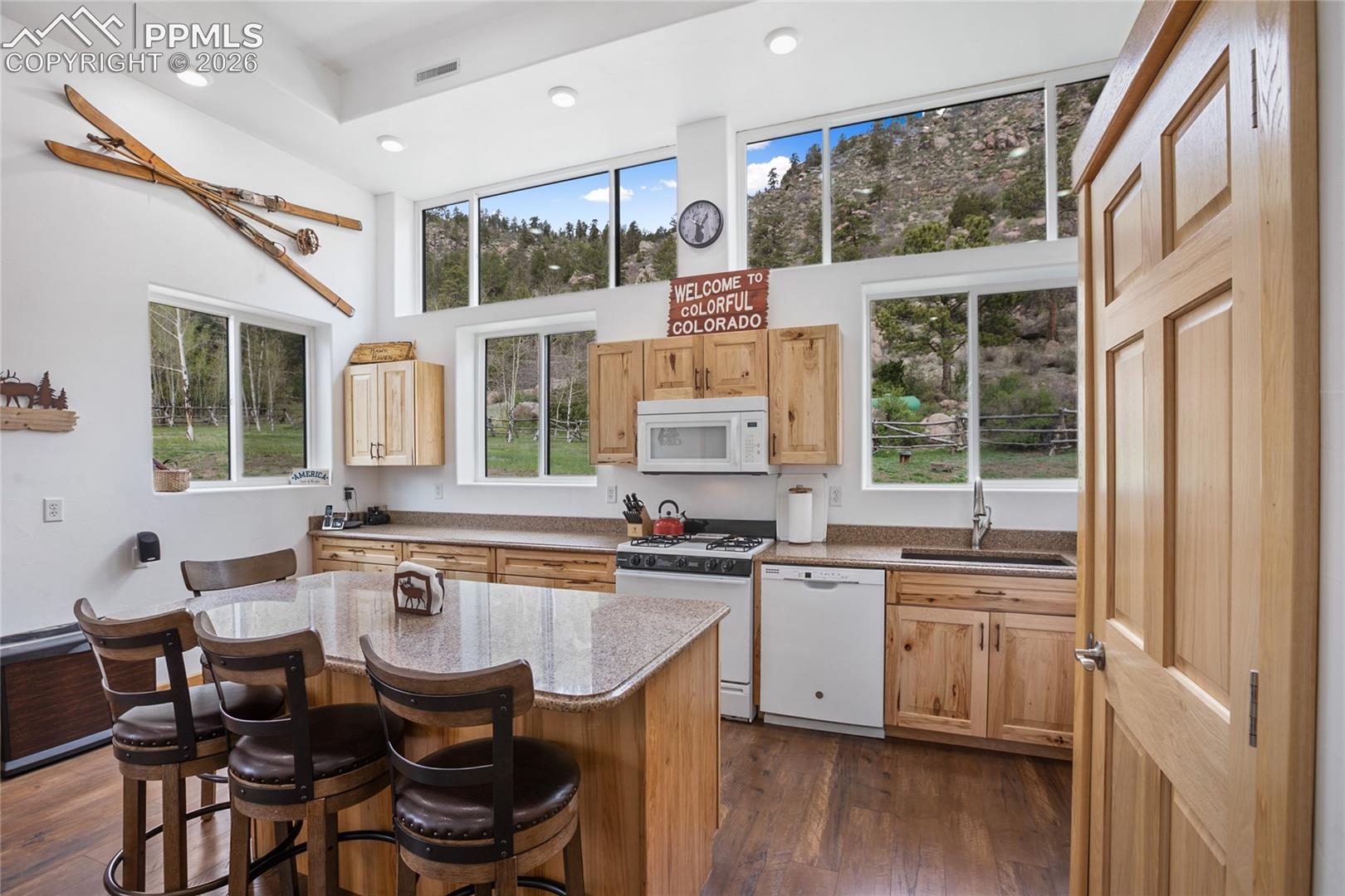 Hickory cabinets, gas stove, even a breakfast bar.
