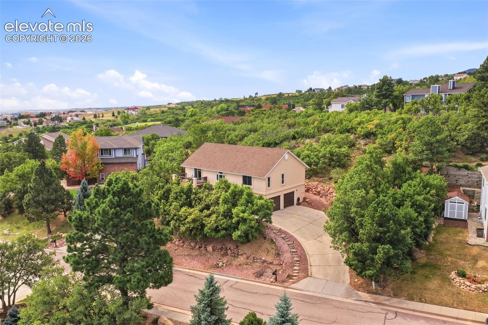 Welcome Home to this beautifully maintained Broadmoor Bluffs Estates raised ranch, where pride of ownership and Colorado living come together. Take in stunning city views to the east and peaceful mountain views to the west, all from a home designed to offer both comfort and flexibility.The open floor plan provides plenty of space for everyday living and entertaining, with generous rooms that can easily be tailored to your needs. French doors allow the Great Room to be opened to the main living and dining areas or closed off for added privacy.The kitchen features beautiful quartz countertops, a 9' quartz sideboard, composite quartz sink, dishwasher and microwave. Additional updates include luxury vinyl flooring in the primary bedroom and bath (2020), roof and garage doors (2020), gutters, downspouts and stucco (2021), updated main-level windows and rear garage window, low-maintenance composite decking, HVAC, humidifier and more. A Daikin system provides added comfort and allows for individualized temperature control throughout the home, complementing the central heating and AC.Expansive windows bring the surrounding scenery into the home, while the outdoor spaces provide plenty of opportunities to enjoy Colorado's natural beauty. The private workshop in the garage provides additional space for hobbies, projects or storage.Located in the award-winning D-12 School District and within walking distance of schools and Broadmoor Bluffs Park, this home also offers convenient access to shopping, dining and everyday amenities. With beautiful views, thoughtful updates and inviting living spaces, this Broadmoor Bluffs Estates home is ready to welcome you home.Schedule your showing today!