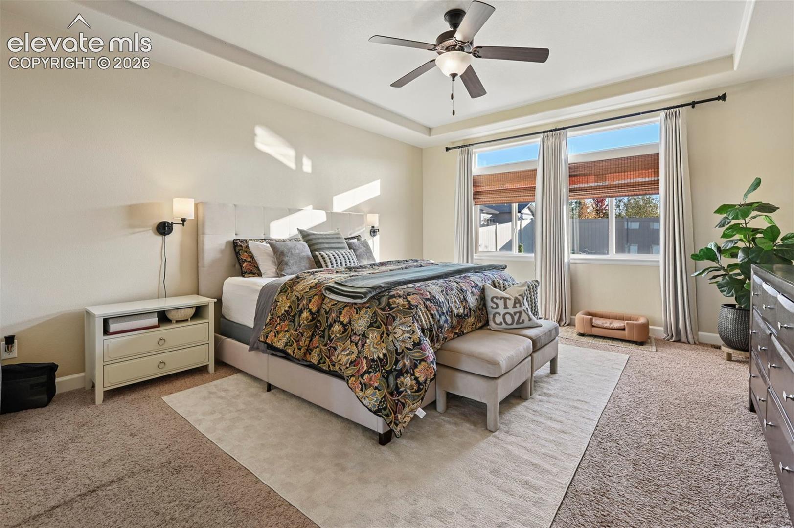 Tray ceiling with a ceiling fan and integrated lighting