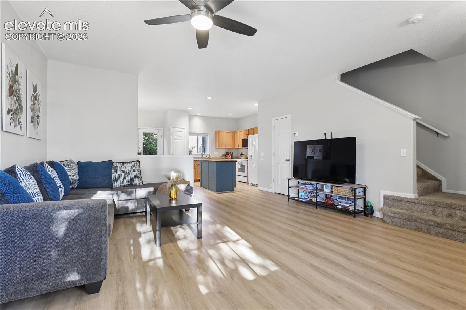 Main living space with 1/2 bath located underneath the stairs
