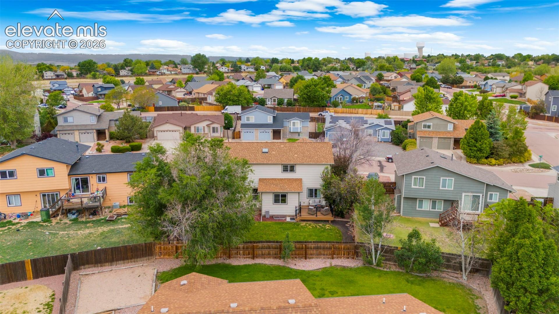 Residential neighborhood featuring a variety of single-family homes with pitched roofs and mature landscaping