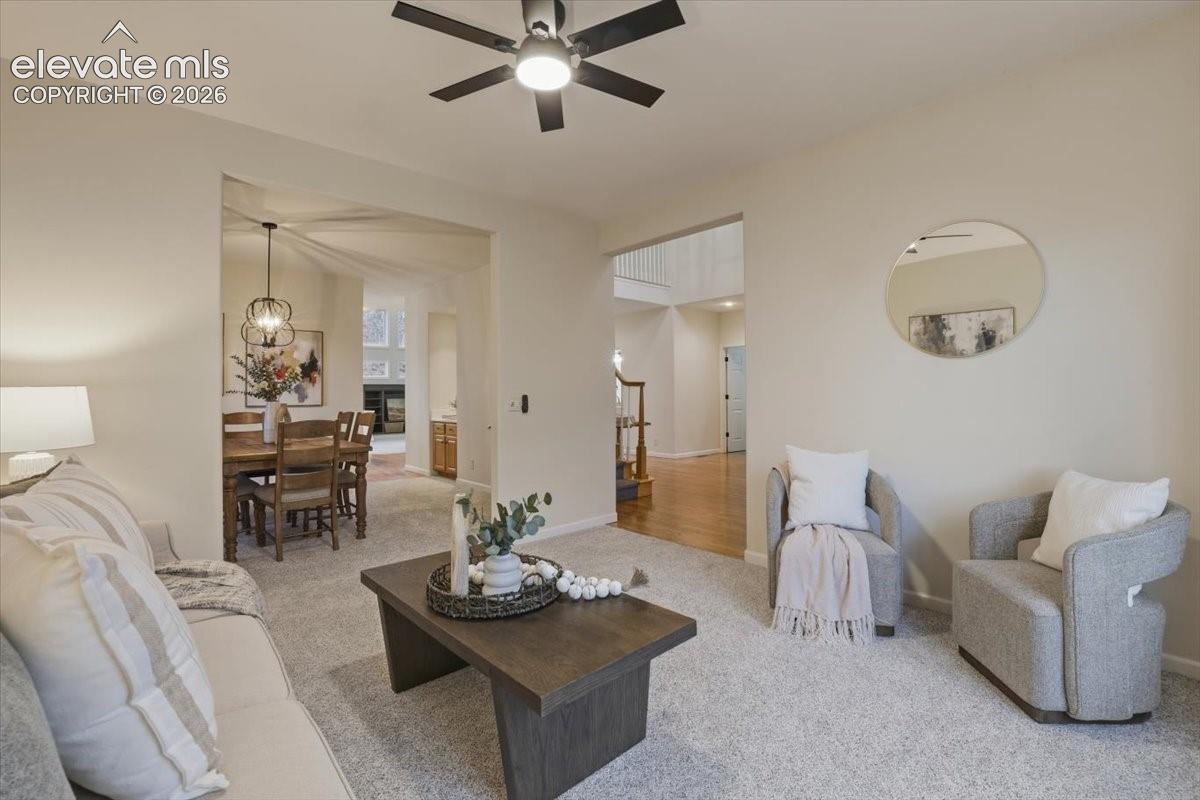 Recessed lighting, ceiling fan with integrated light, and neutral wall tones