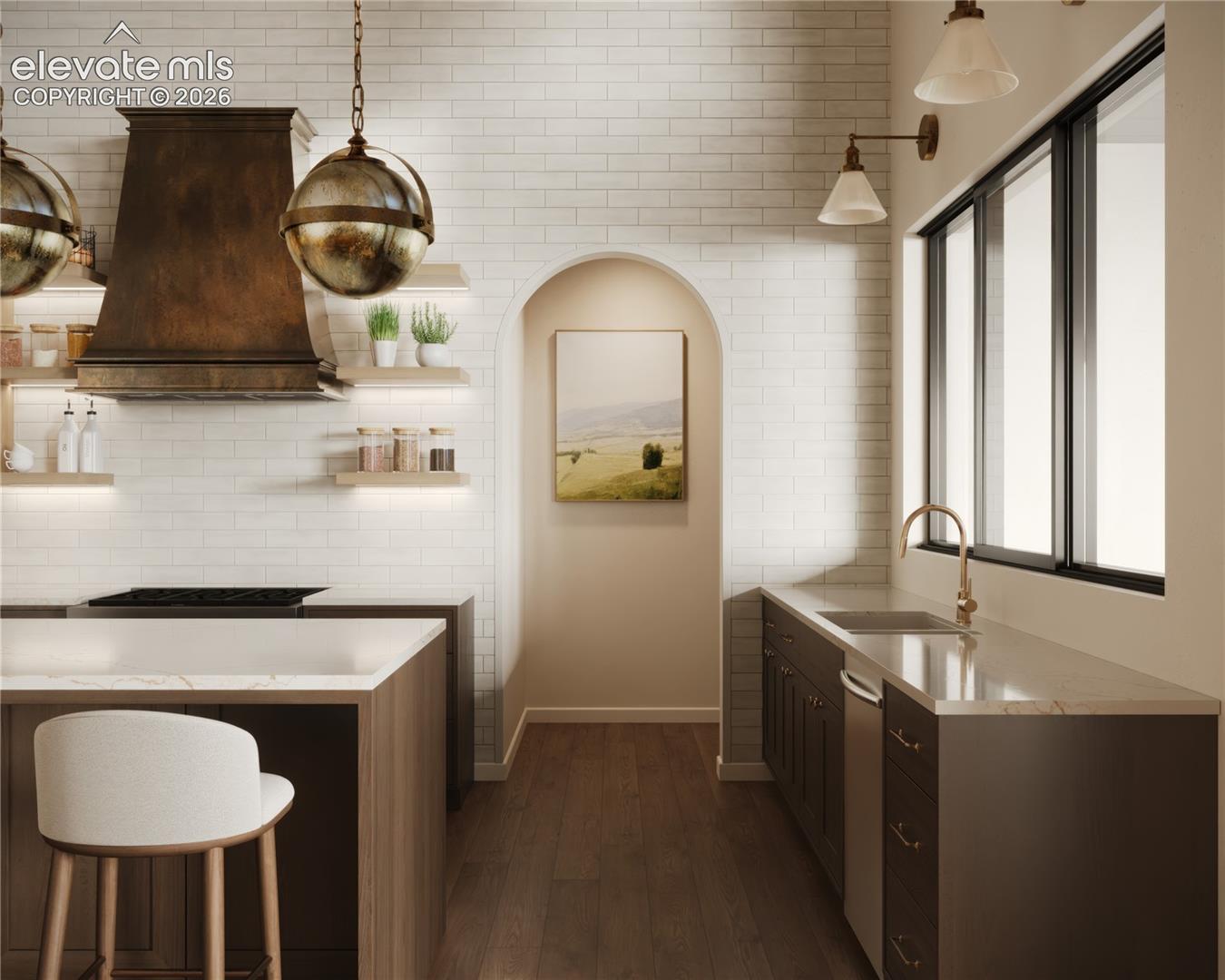 Gourmet kitchen with white subway tile backsplash, a large kitchen island, hardwood flooring, and a built-in range