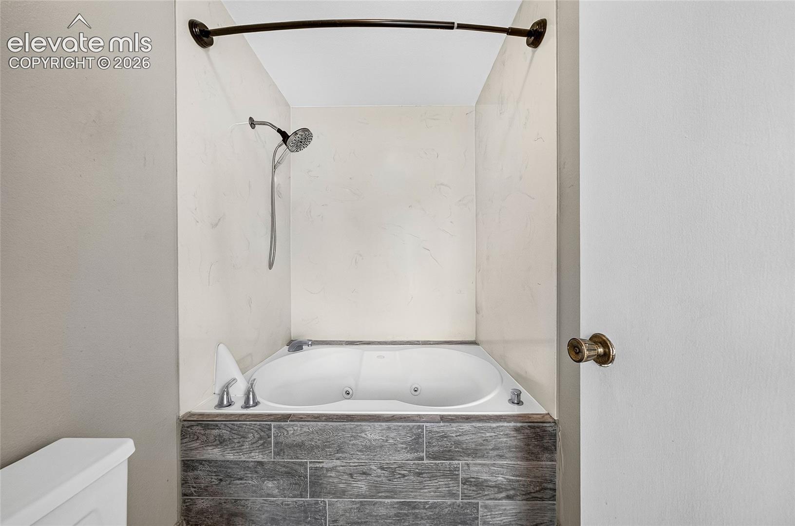 Primary bathroom has jetted tub.