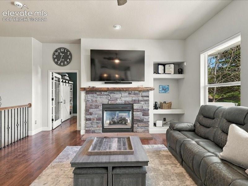 Stone-faced fireplace with a wood mantel