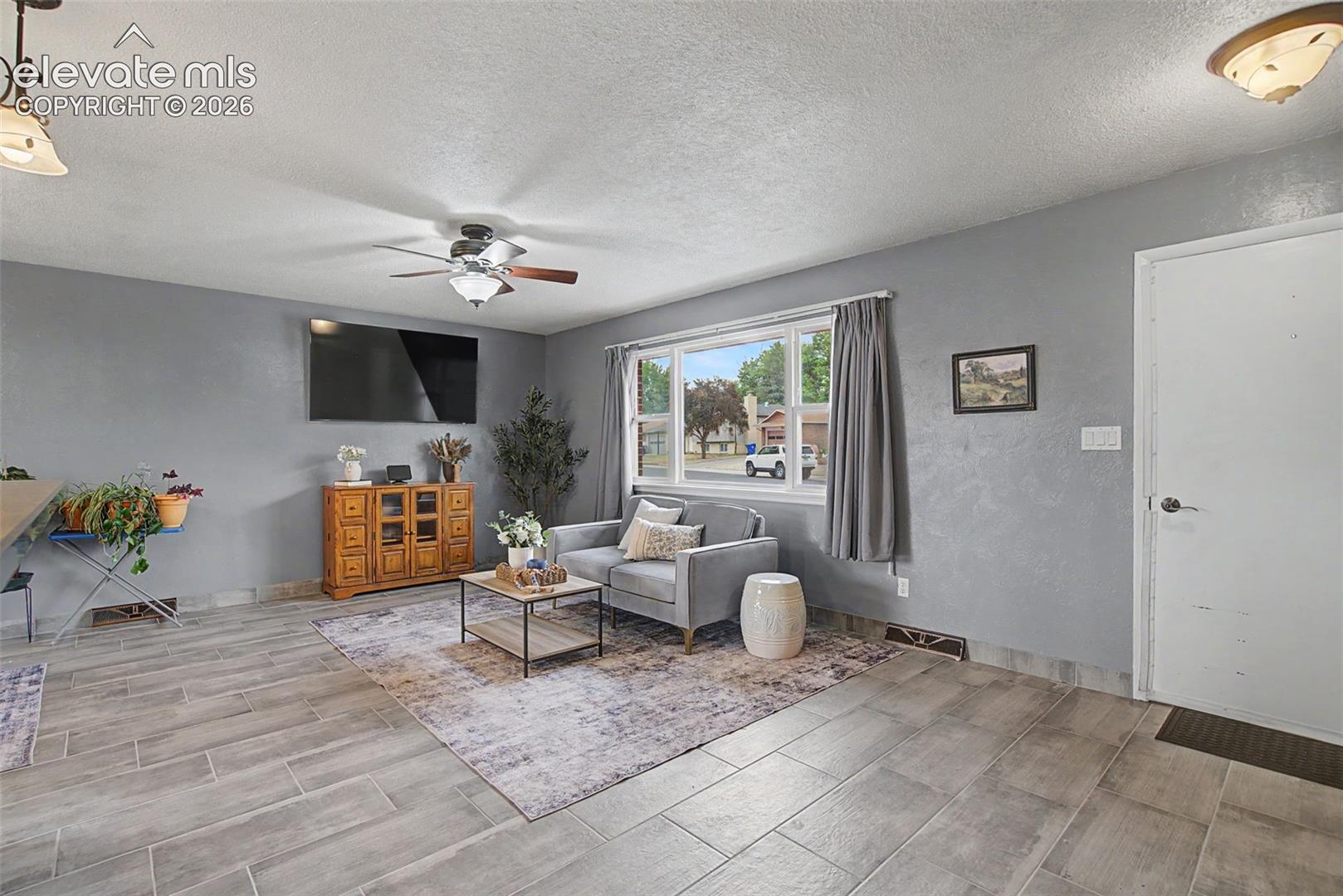 Spacious Living Room Open to Dining Area