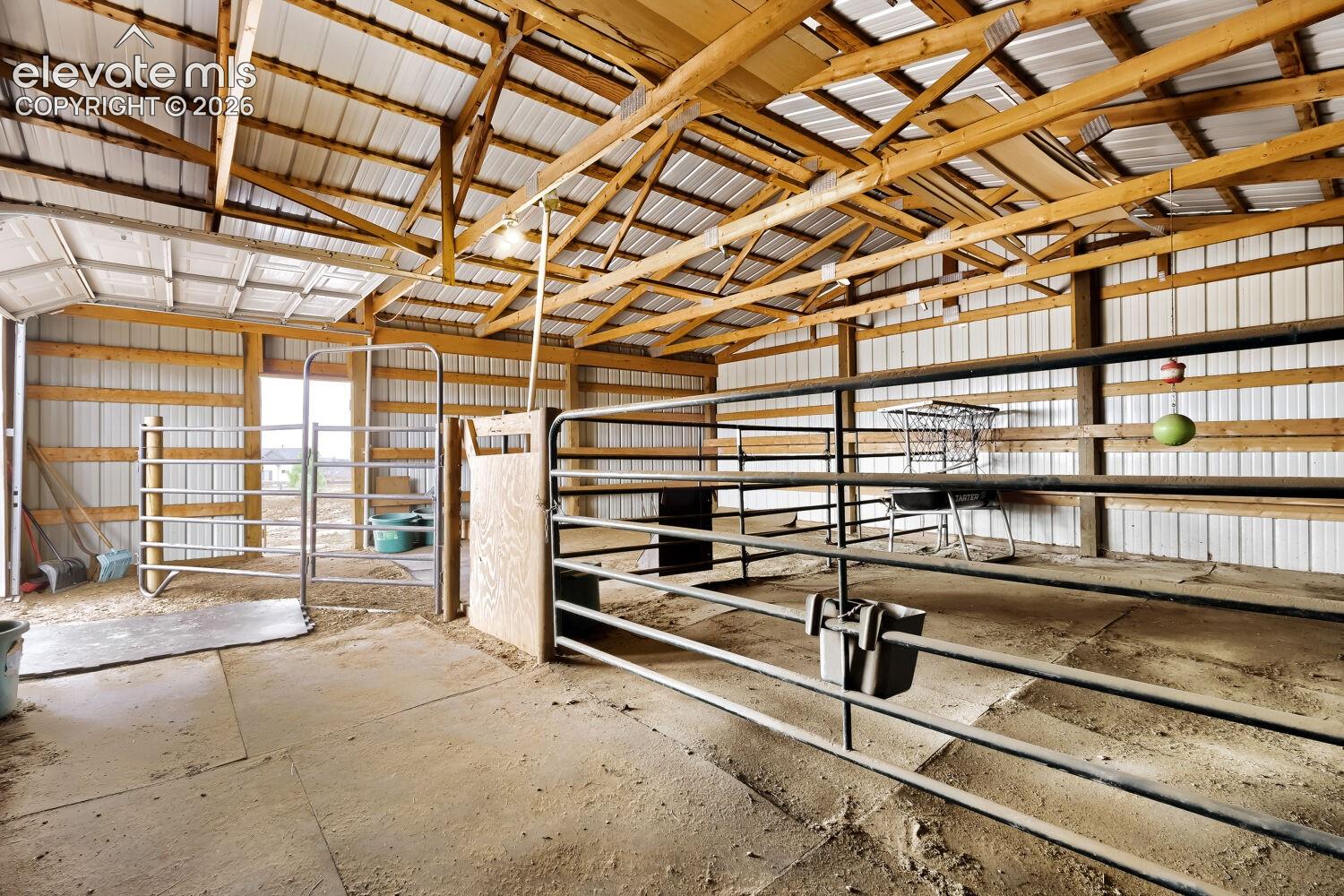 Large enclosed barn equipped with two stalls and the opportunity to add more stalls. Features include two heated watering devises and rubber floor mats.