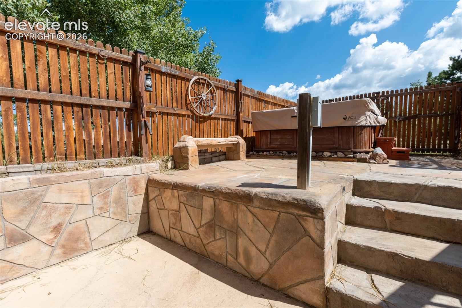 Hot tub with privacy fence enclosed beautiful custom cement floor decking. 