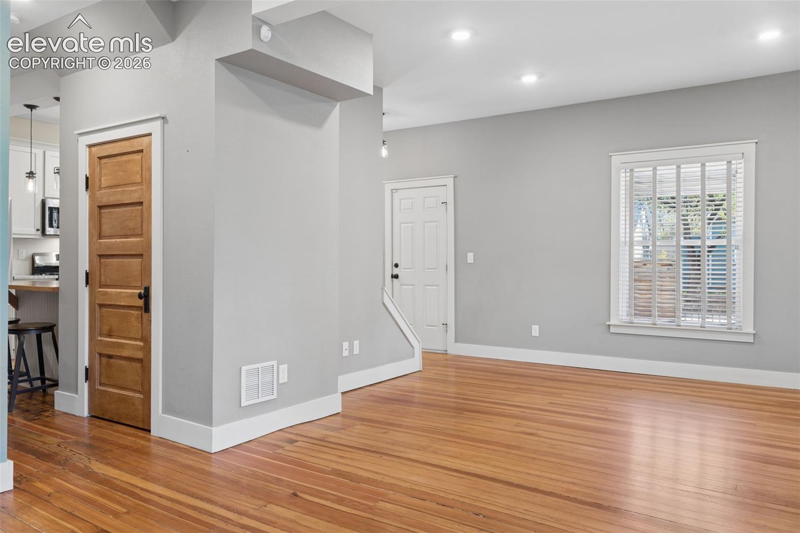 Original wood floors and original five-panel wood doors