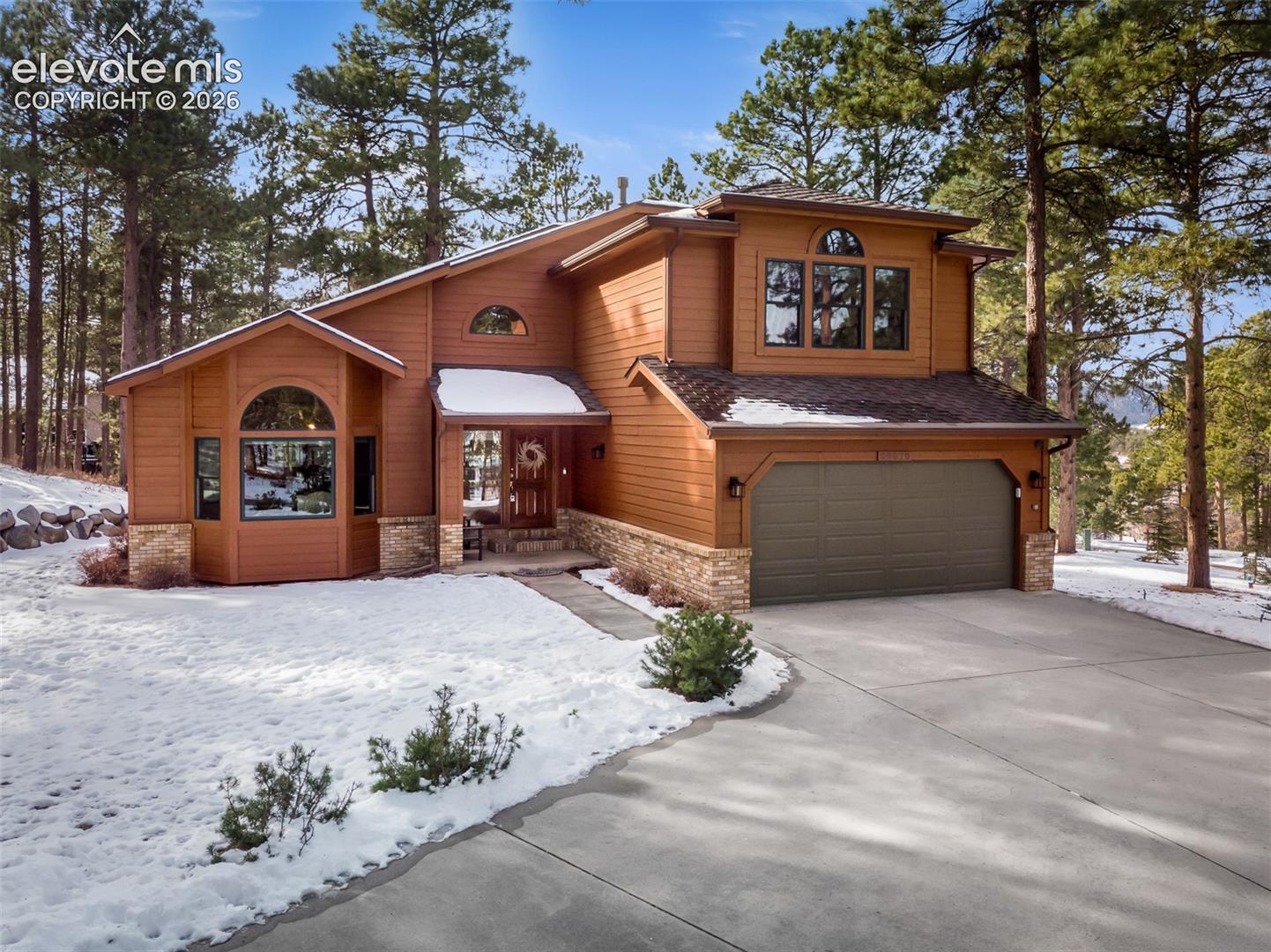 Nestled in the quiet Woodcrest area of Woodmoor, this immaculate and meticulously maintained home sits on a generous .68-acre lot, offering a peaceful Colorado setting with quick access to I-25. Located in the highly regarded Lewis-Palmer D38 School District, this home blends thoughtful updates, timeless comfort, and exceptional pride of ownership.Recent upgrades include updated bathrooms, fresh interior paint, new carpet, updated tile, modern lighting, a new roof with gutter covers, and two gas fireplaces that bring warmth and ambiance throughout the home. The chef-inspired kitchen is a standout, featuring rich wood cabinetry, granite countertops, premium Wolf appliances, and an inviting eat-in nook—perfect for both everyday living and entertaining.Enjoy outdoor living on the beautiful, peaceful deck surrounded by mature Colorado landscaping, or extend your living space into the walk-out basement, offering flexibility for guests, recreation, or additional gathering space. Set on nearly three-quarters of an acre, this home offers space, privacy, convenience, and exceptional care in one of Woodmoor’s most desirable settings.This is one of Colorado’s Finest.