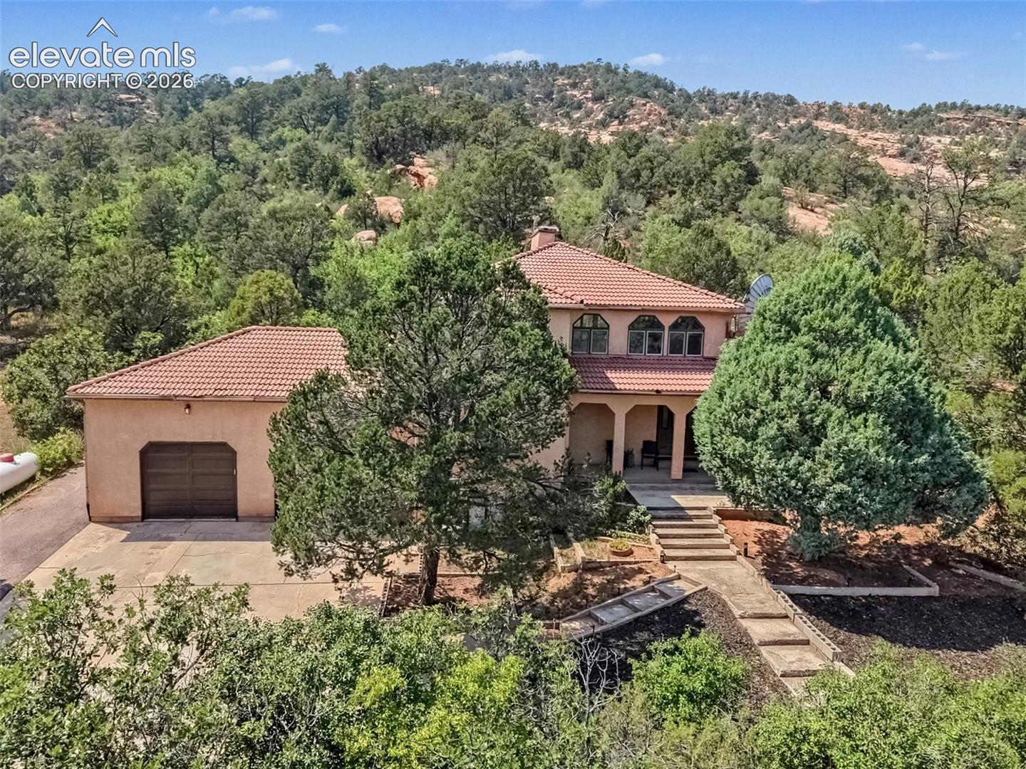 Mature trees, surrounding natural landscape, and the privacy and peaceful setting of Red Rock Valley