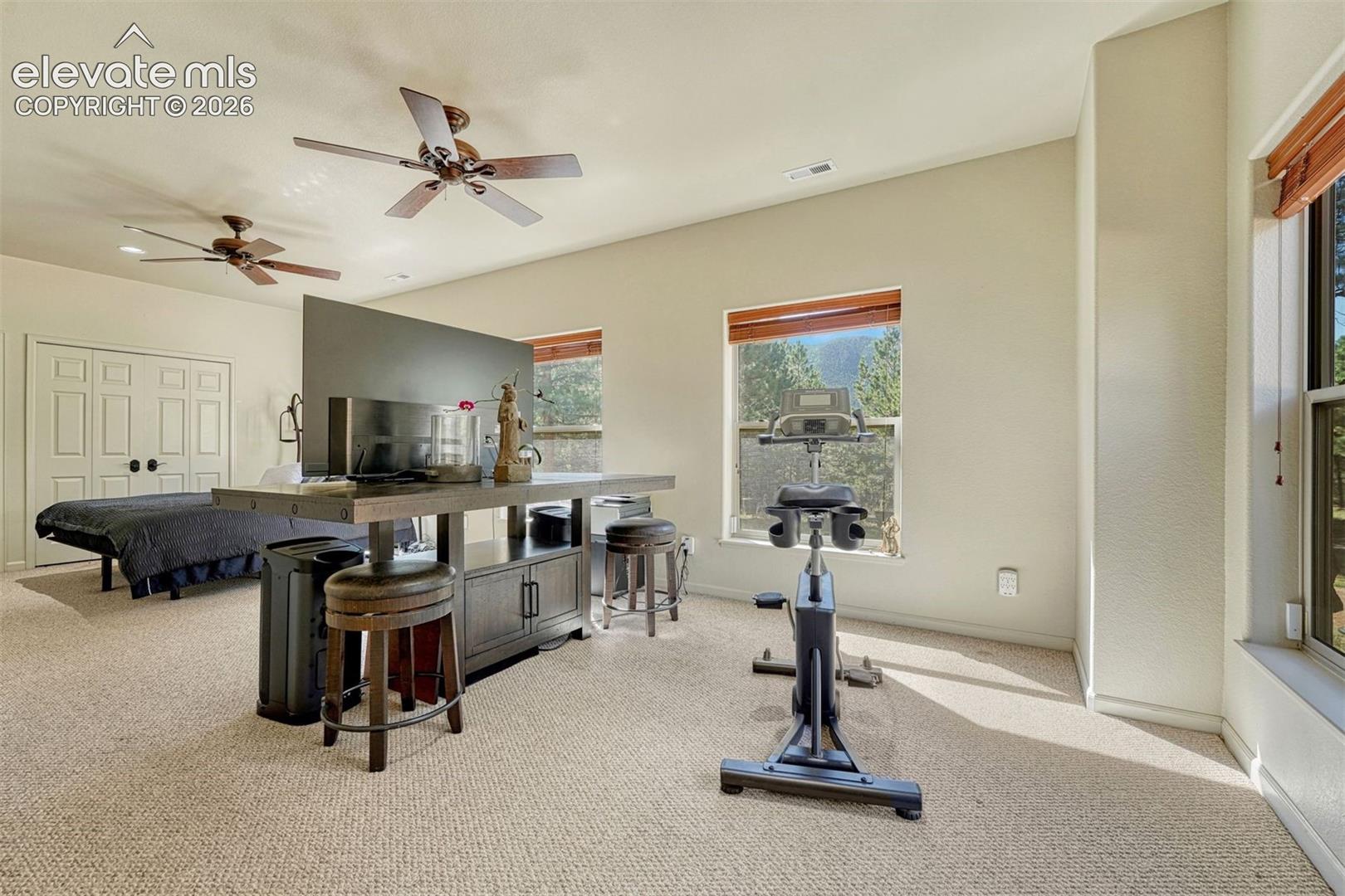 Space to work out or sitting area as the sun rises and shines through the east windows