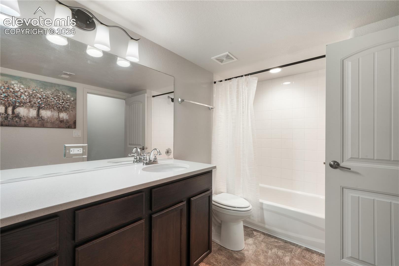 Basement full bathroom with quartz countertops