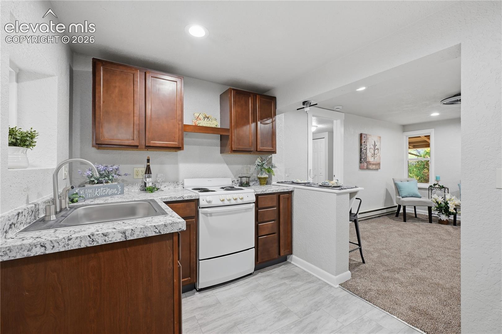 Another view of the apartment kitchen.