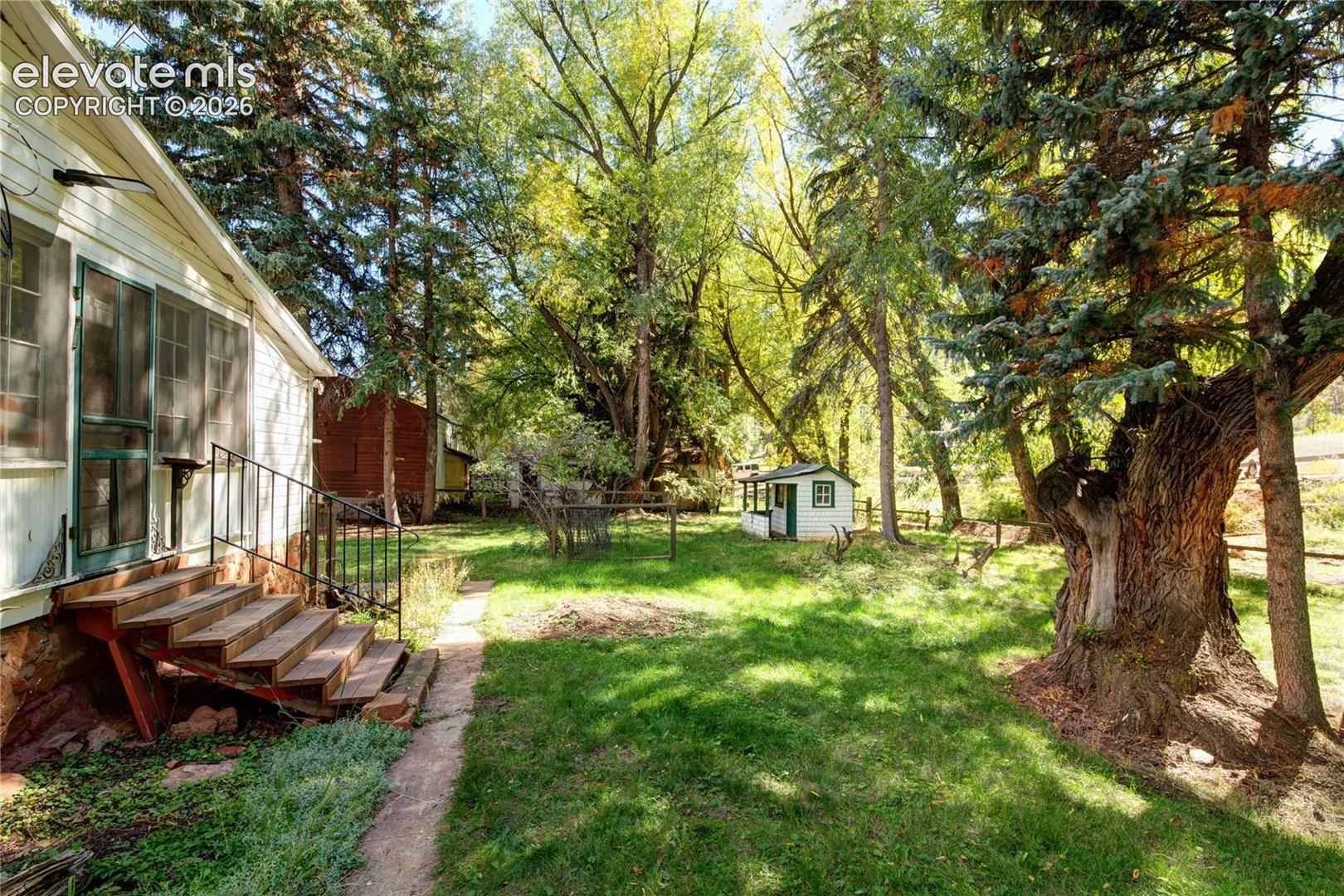 Side of the house with playhouse 