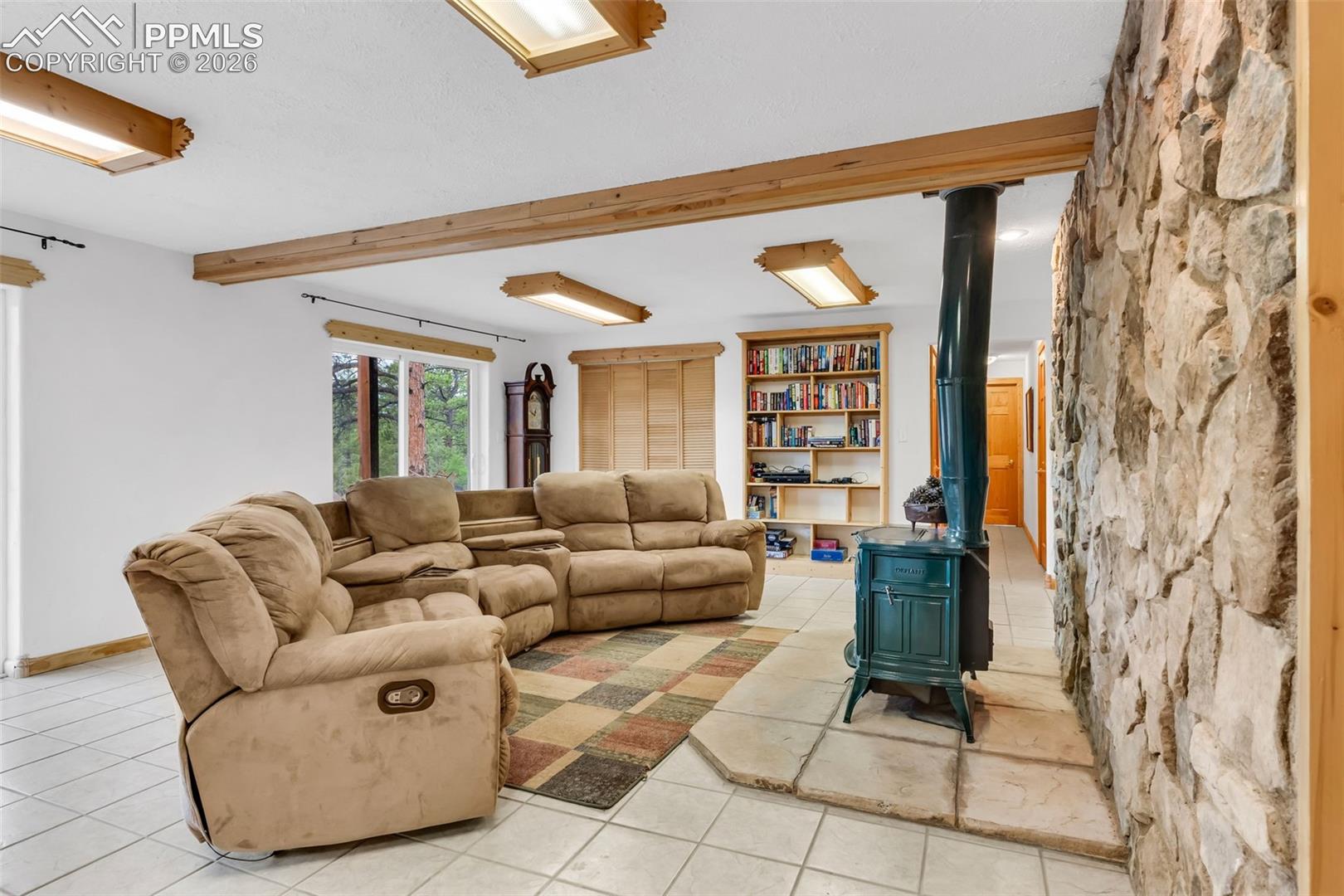 Hallway on the right leads to 2 additional bedrooms, full bathroom, and mechanical room