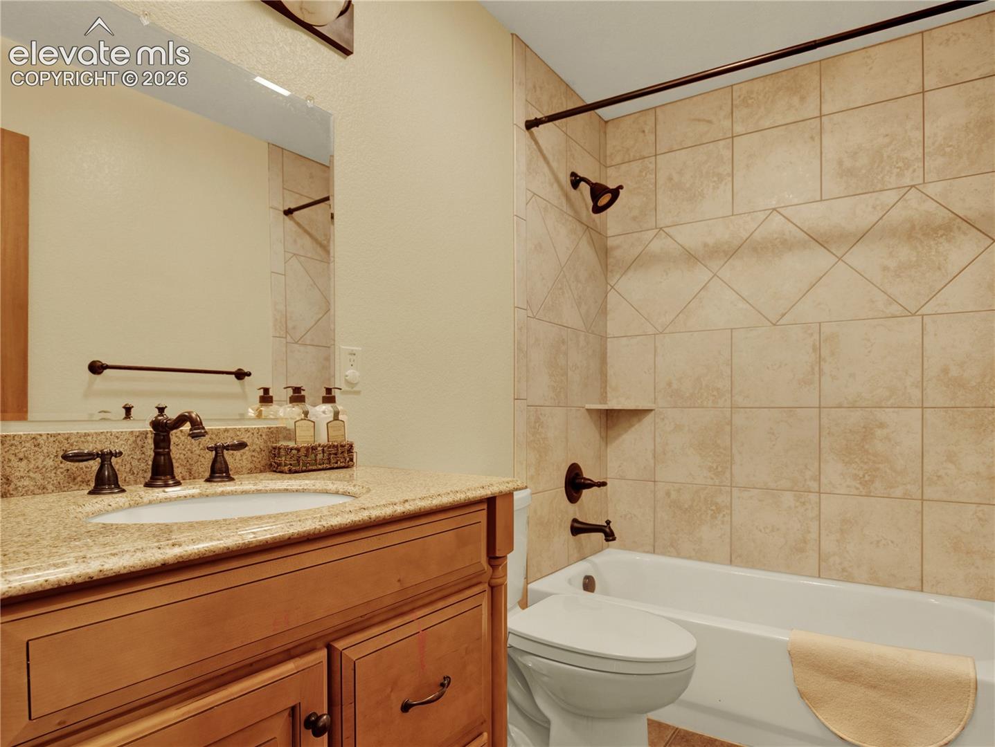 Additional full main level bathroom located between the laundry room and the 2nd main level bedroom