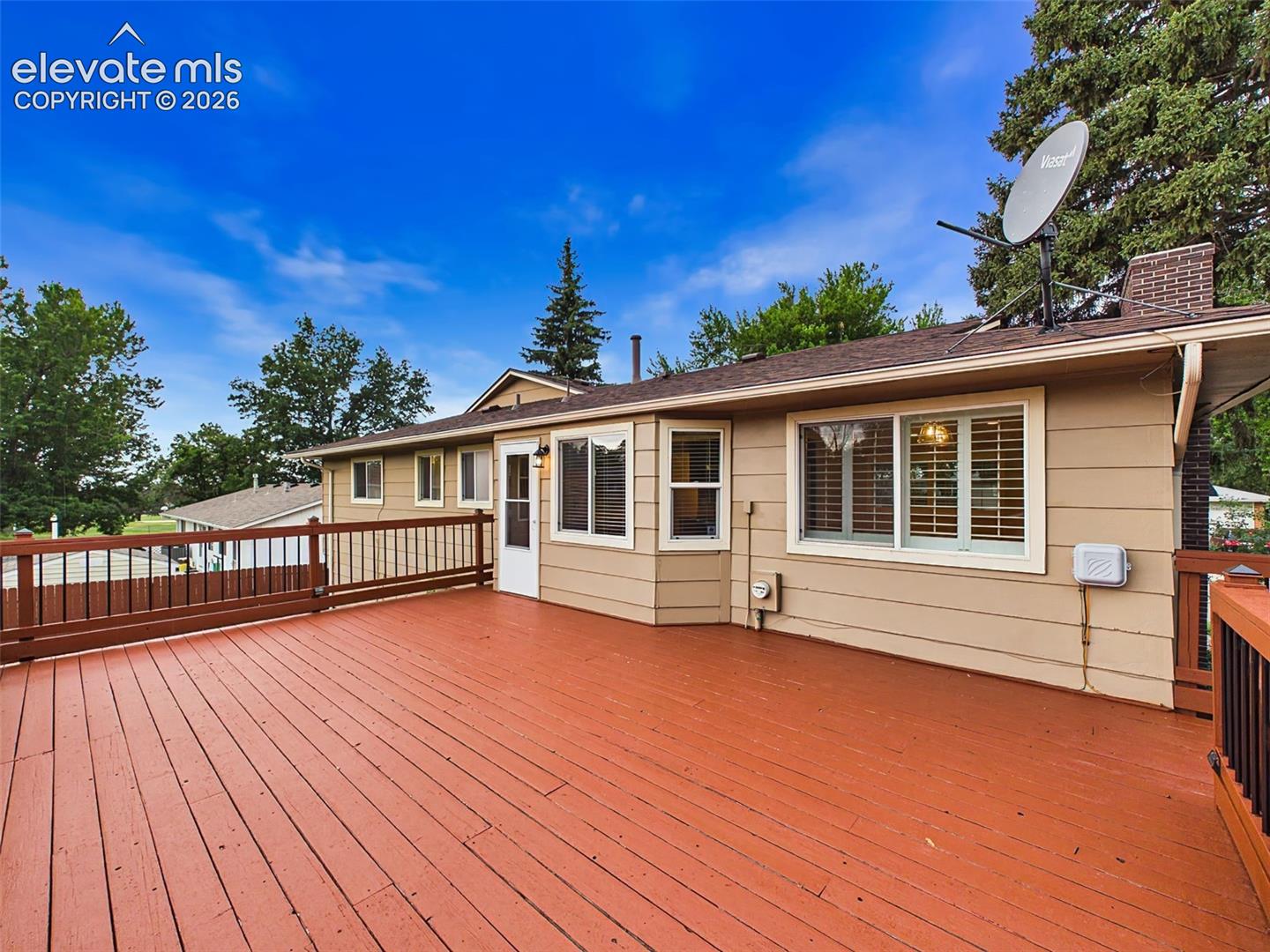 Large elevated deck provides the perfect setting for outdoor dining, entertaining, or relaxing while overlooking the backyard.