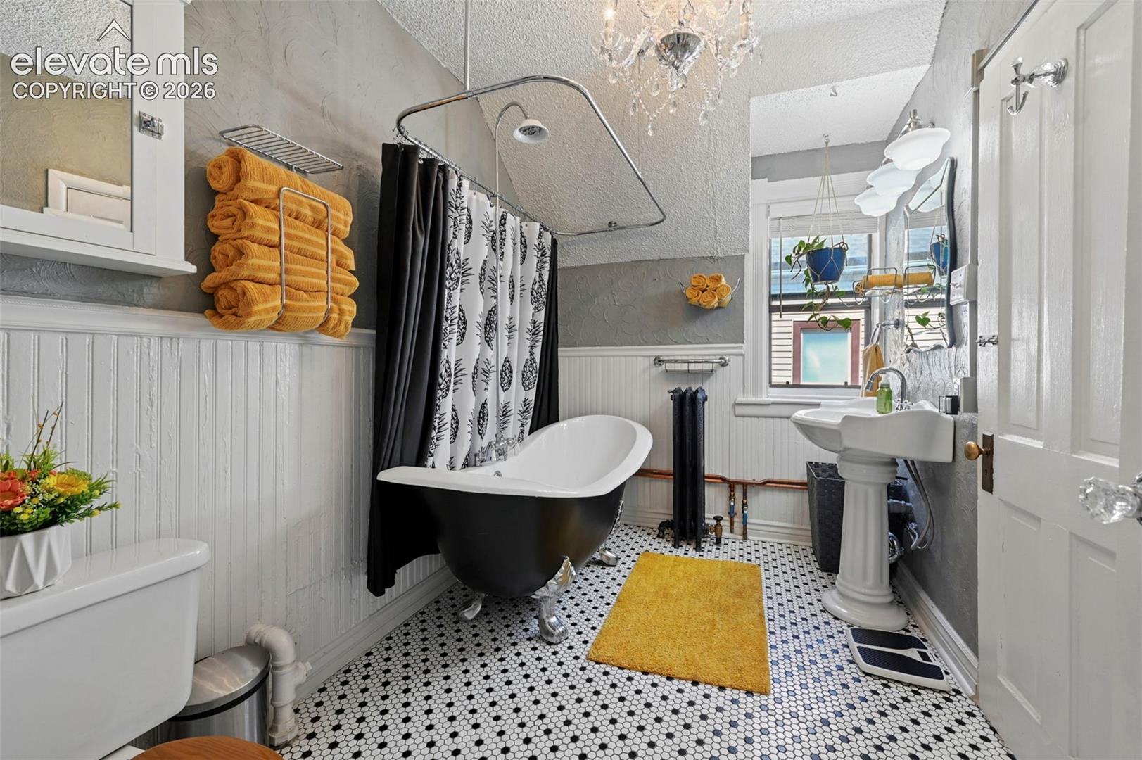 Full Bath with tile floors and Cast Iron Double Slipper Lions Claw tub/shower