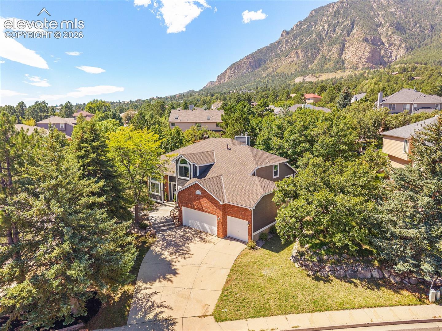 Nestled in the trees and mountain backdrop