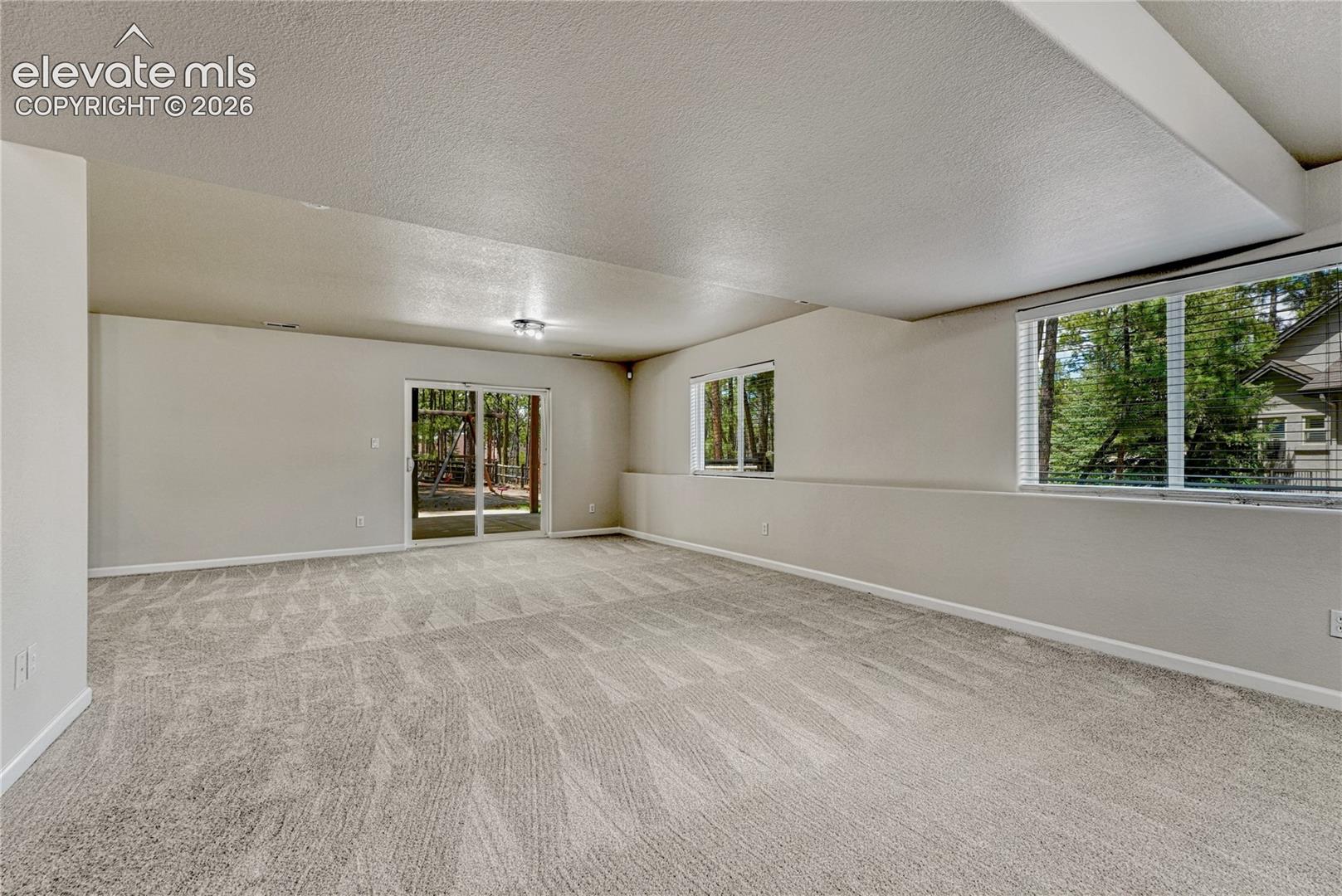 Finished walk-out basement with above-grade windows. 
