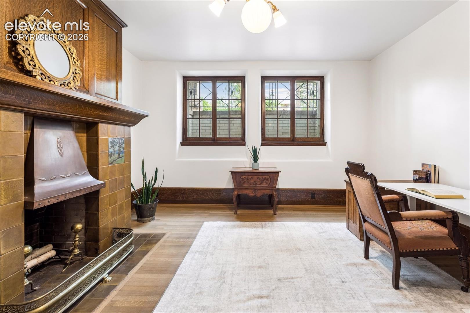 Basement den with 5 of seven Van Briggle fireplaces