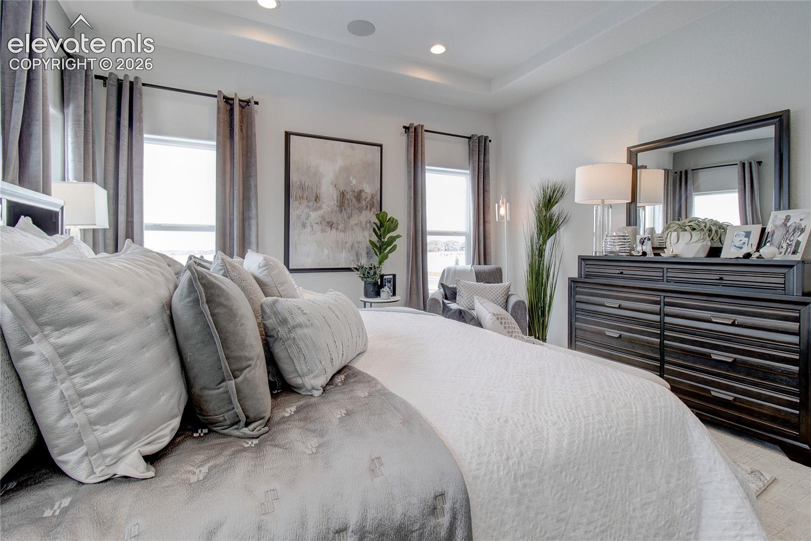 Tray ceiling featuring recessed lighting and integrated speakers