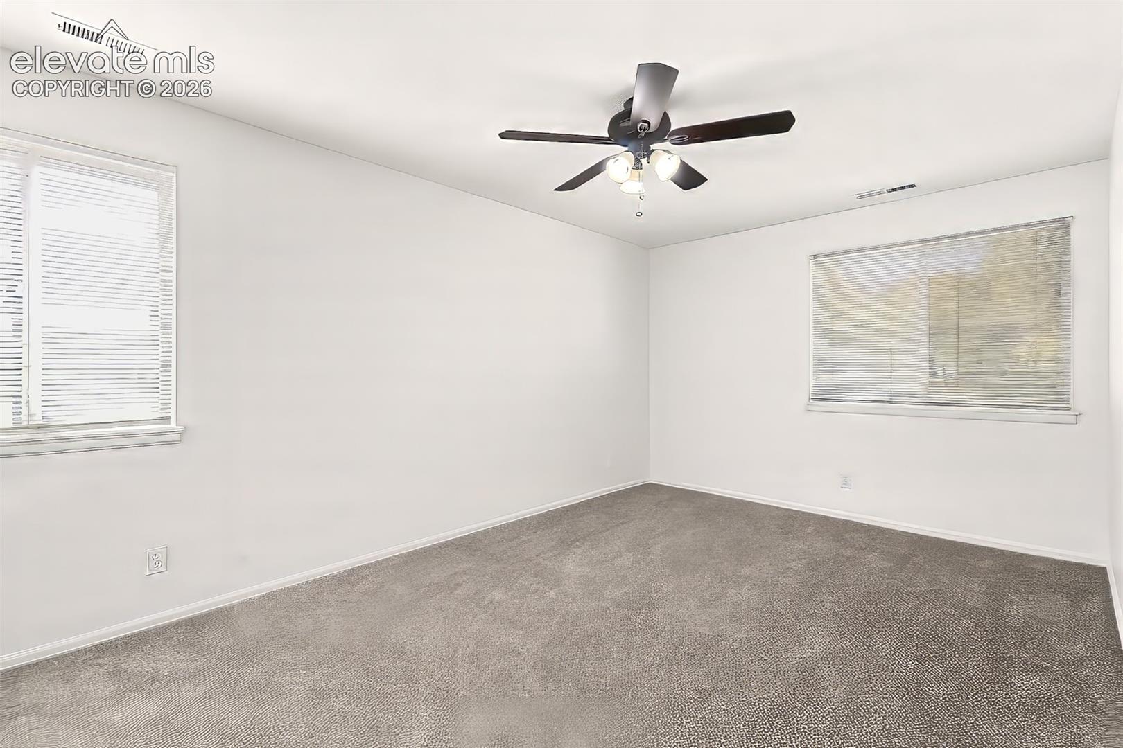 Large primary bedroom with walk-in closet and attached 3/4 bathroom.
