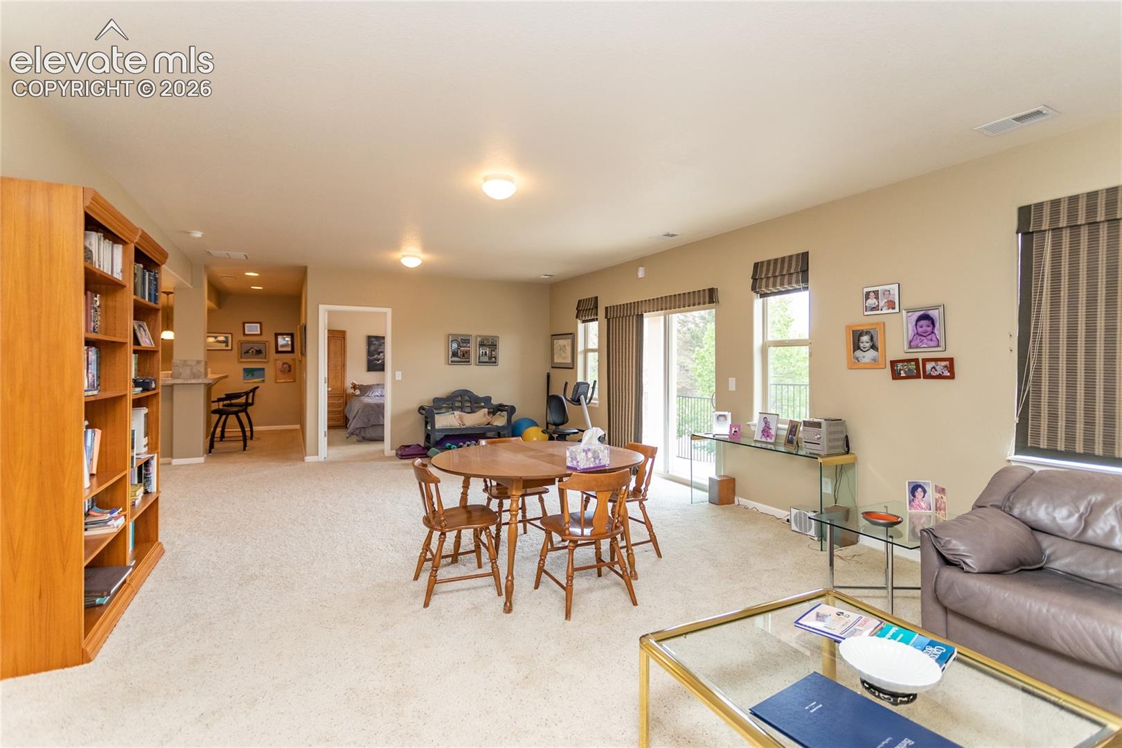 Walk out sliders let in lots of light & give you access to a lower patio outside.