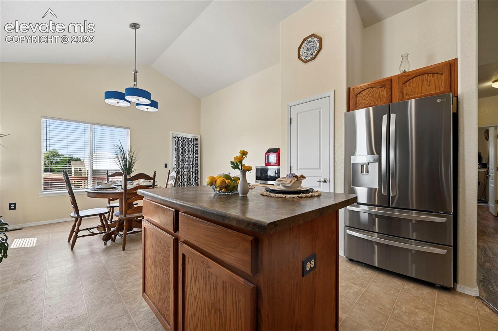 Kitchen flows smoothly into large dining area.