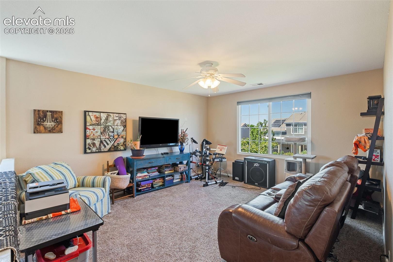 Loft with large window providing lots of light.