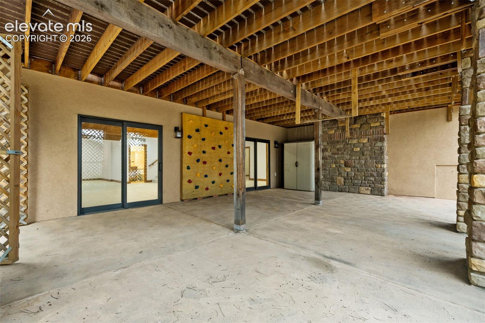Covered patio with climbing wall