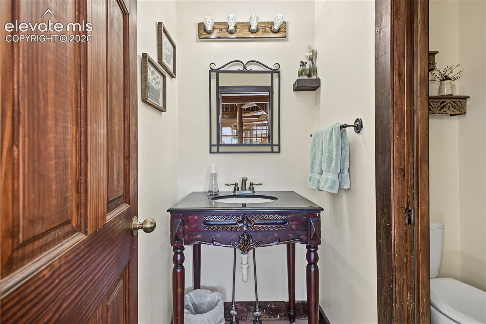 Wood panel door with brass hardware