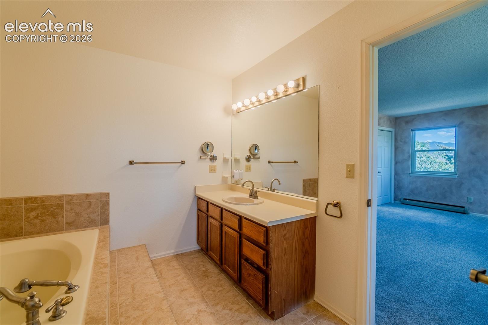 Built-in bathtub with tiled surround